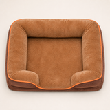 Brown raised-bolster dog bed viewed from above